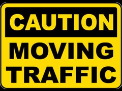 Caution Moving Traffic Sign